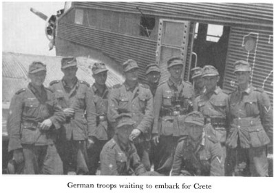 Black and white photograph of troops in front of an airplane