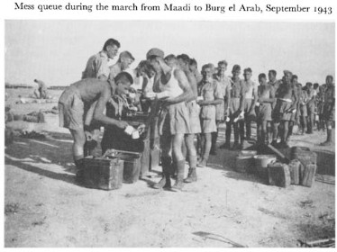 Black and white photograph of soldiers in a que